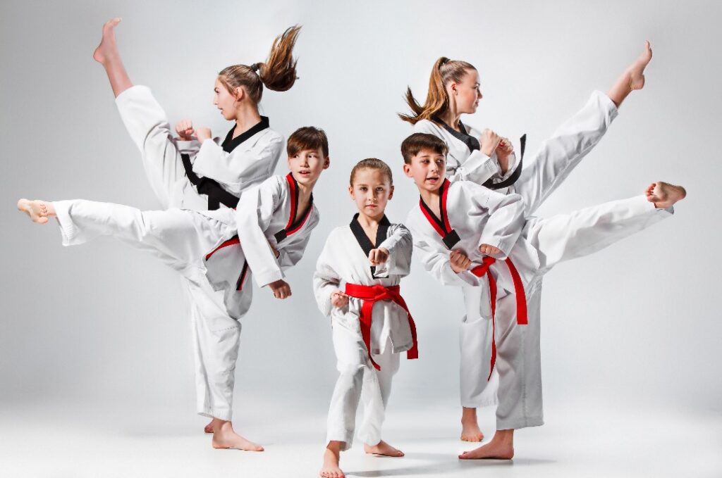 The studio shot of group of kids training karate martial arts